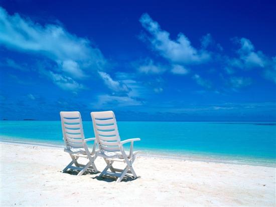 two_beach_chairs_on_the_beach_wallpaper_medium